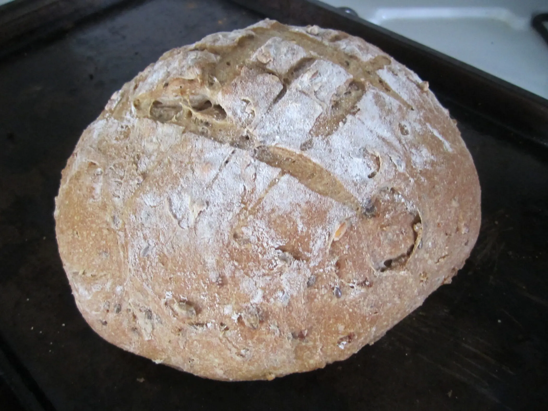 baked loaf of multigrain bread