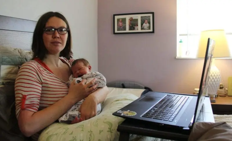 working from bed with a newborn