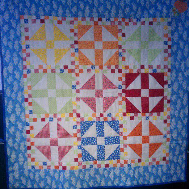 Stepmom-made baby quilt gift.