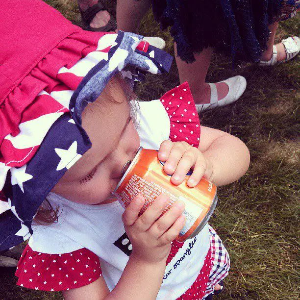 Daughter receives first soda from dad.