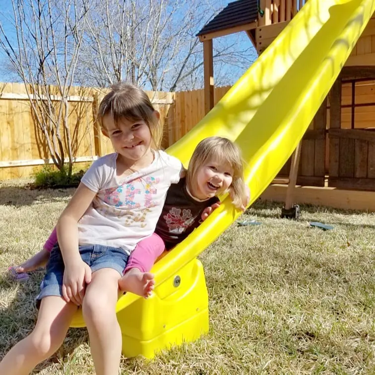 Girls receive swing set for Christmas.