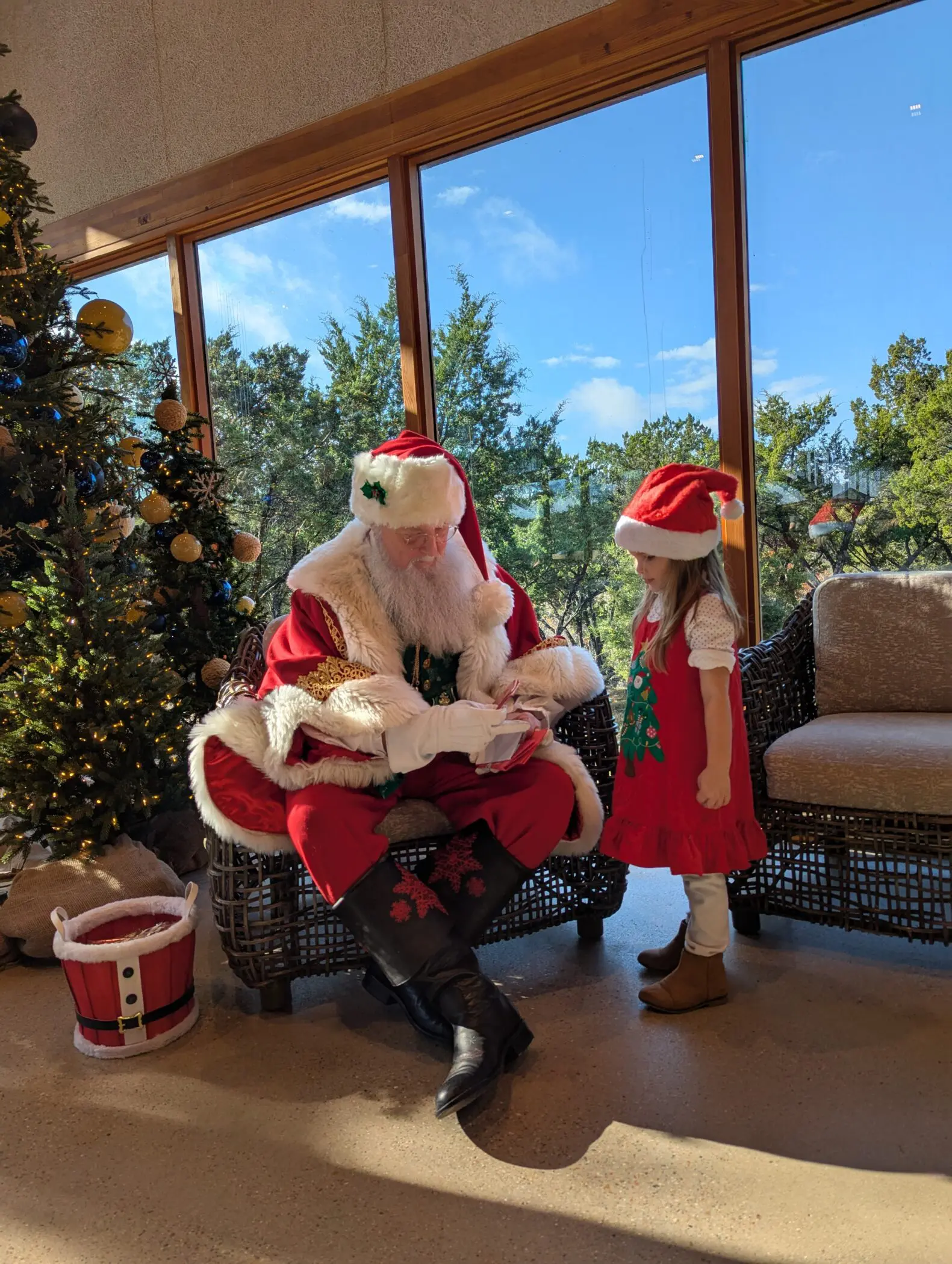 Vivienne standing talking to Santa.