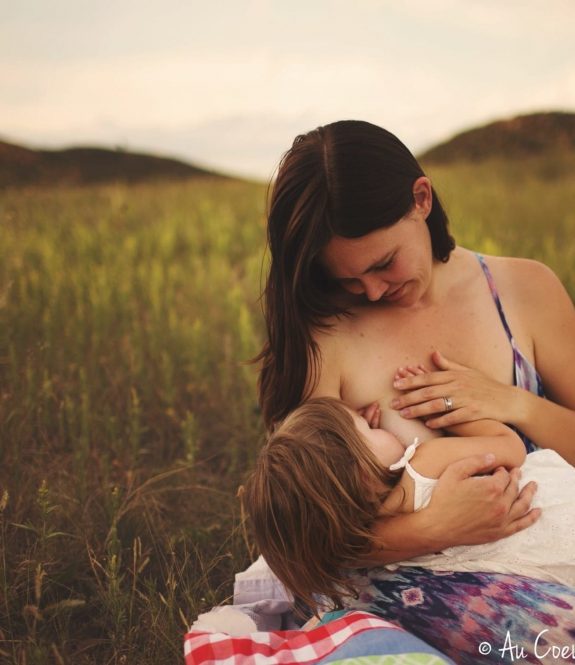 Amber breastfeeding Zara in field